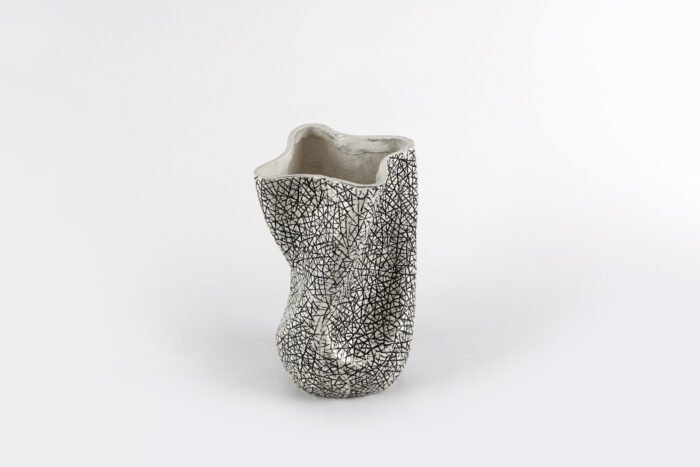Textured artisan vase with cracked surface design and flowing silhouette – handcrafted decorative object for modern homes