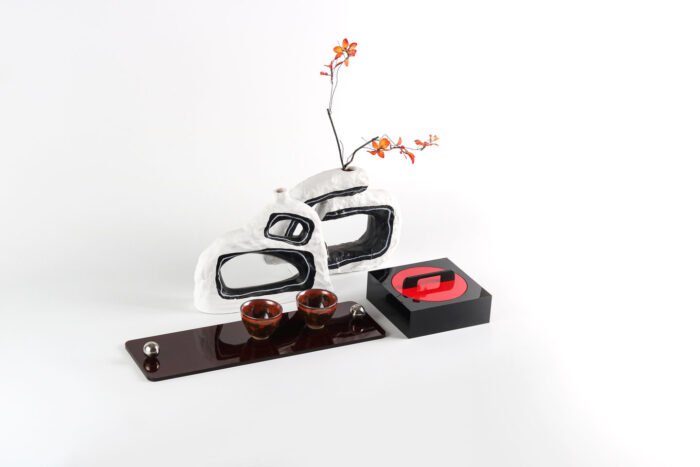 Modern black acrylic tray with silver ball handles.