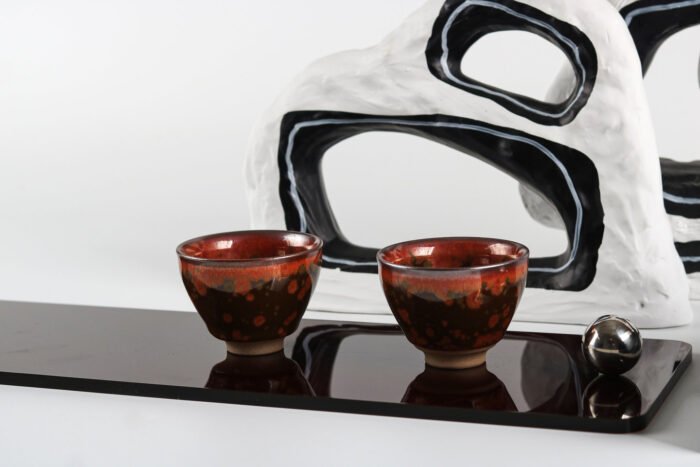 Modern black acrylic tray with silver ball handles.
