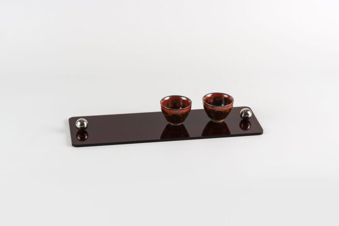 Modern black acrylic tray with silver ball handles.
