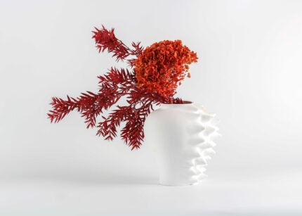 White sculptural ripple vase handcrafted with textured detail – modern artisan statement decor