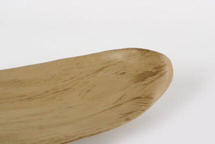 Leaf shaped bohemian tray with organic curves and natural finish.