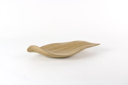 Leaf shaped bohemian tray with organic curves and natural finish.