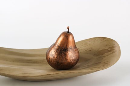 Leaf shaped bohemian tray with organic curves and natural finish.