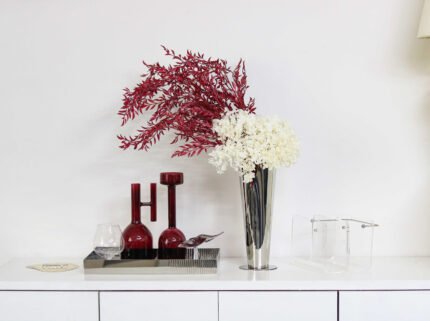 Tall silver sculptural vase with reflective finish and curved design – handcrafted for modern interiors