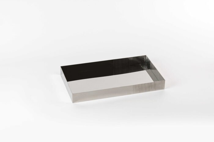 Onyx Reflection Stainless Steel Tray – rectangular stainless tray with black mirrored base and fluted sides.