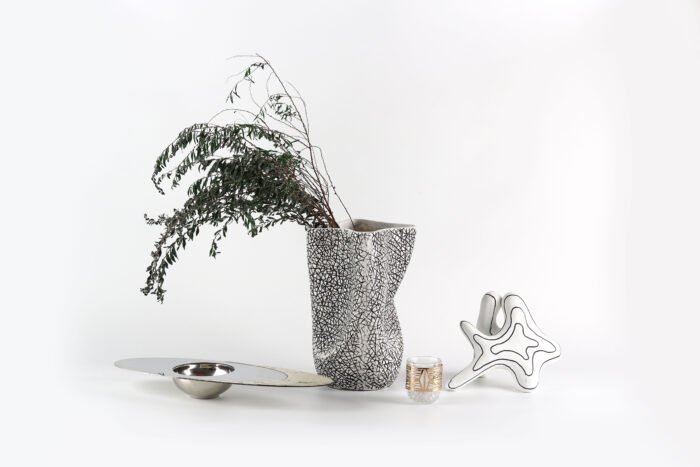 Textured artisan vase with cracked surface design and flowing silhouette – handcrafted decorative object for modern homes