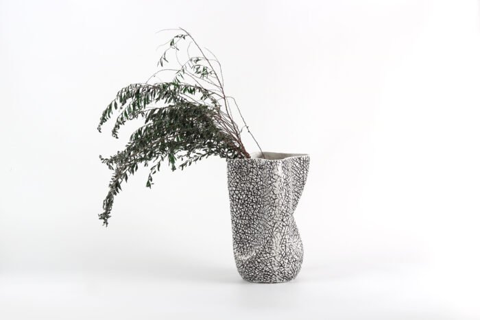Textured artisan vase with cracked surface design and flowing silhouette – handcrafted decorative object for modern homes