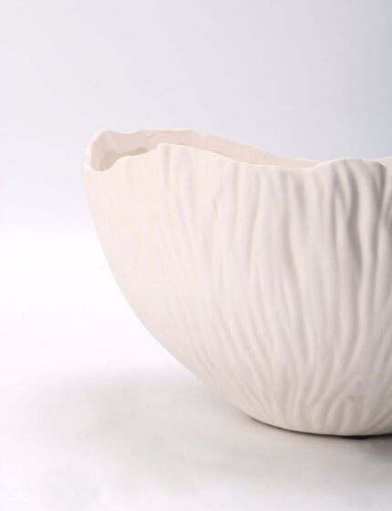 Textured minimalist white bowl with wave-inspired shape, Waves of Calm.