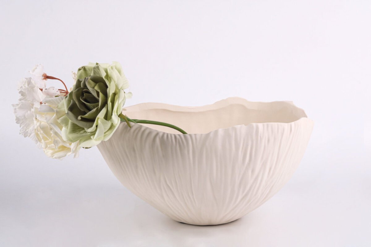 Textured minimalist white bowl with wave-inspired shape, Waves of Calm.