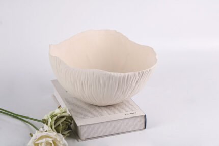 Textured minimalist white bowl with wave-inspired shape, Waves of Calm.