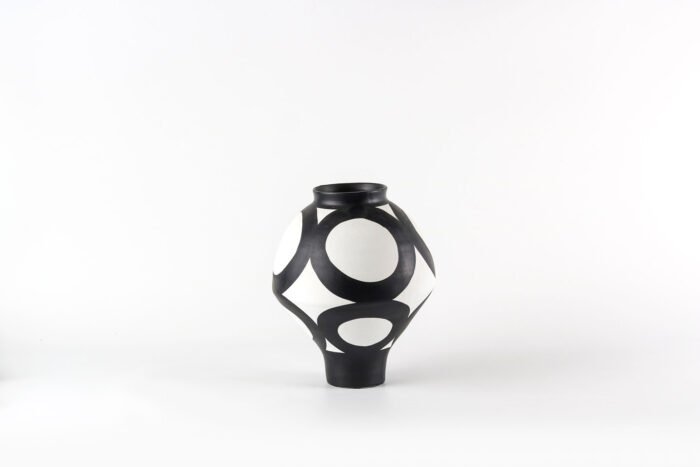 Geometric black and white vase with flowers, Monochrome Harmony design.