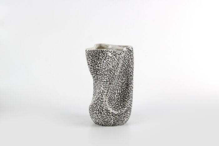 Textured artisan vase with cracked surface design and flowing silhouette – handcrafted decorative object for modern homes