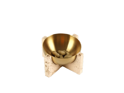 Brass bowl resting on travertine legs – minimalist wabi-sabi style centerpiece for Japandi interiors