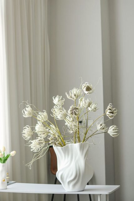white flowing vase UAE styled as minimalist console decor