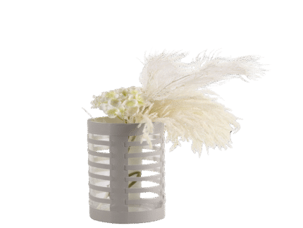 White decorative vase with architectural cutout design and cylindrical shape, styled with dried florals for modern home interiors.